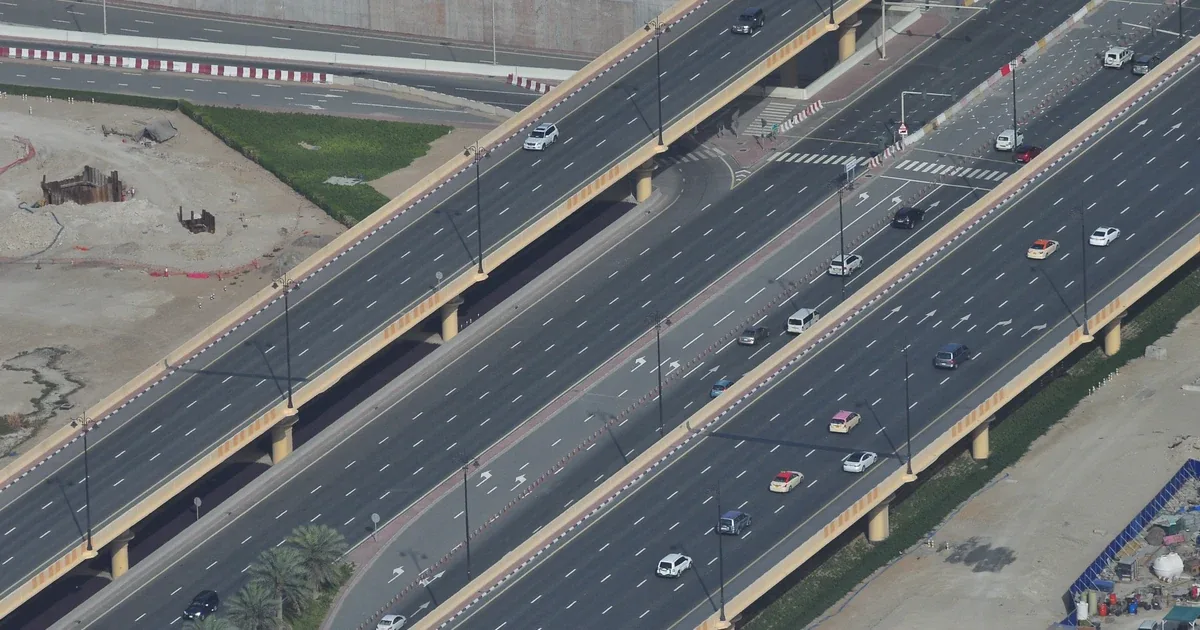 Real photograph of cars travelling on multilane roads in Dubai, photographed by Roman Logov.